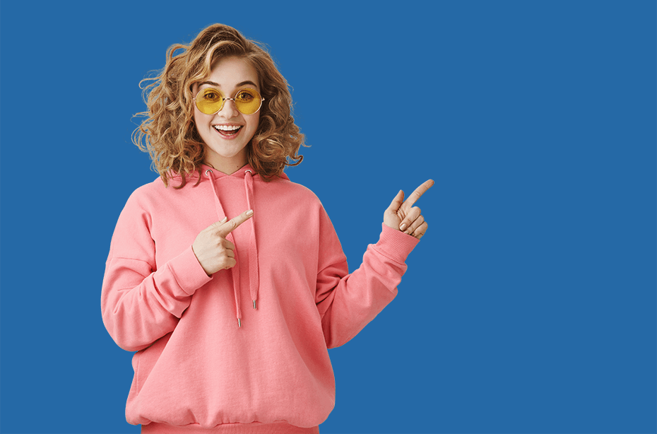 excited-stylish-curly-haired-girl-sunglasses-pointing-right-showing-way